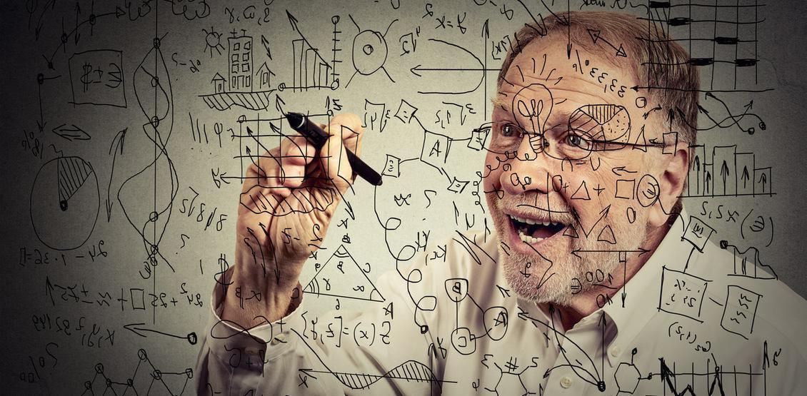 Senior scientist writing secret formula with pen