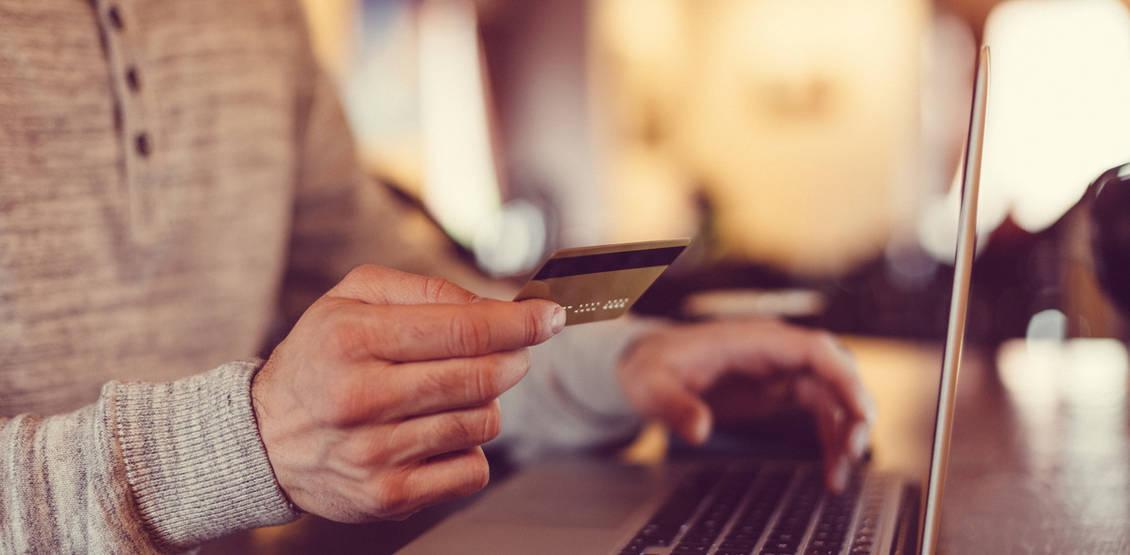 Man making credit card purchase online