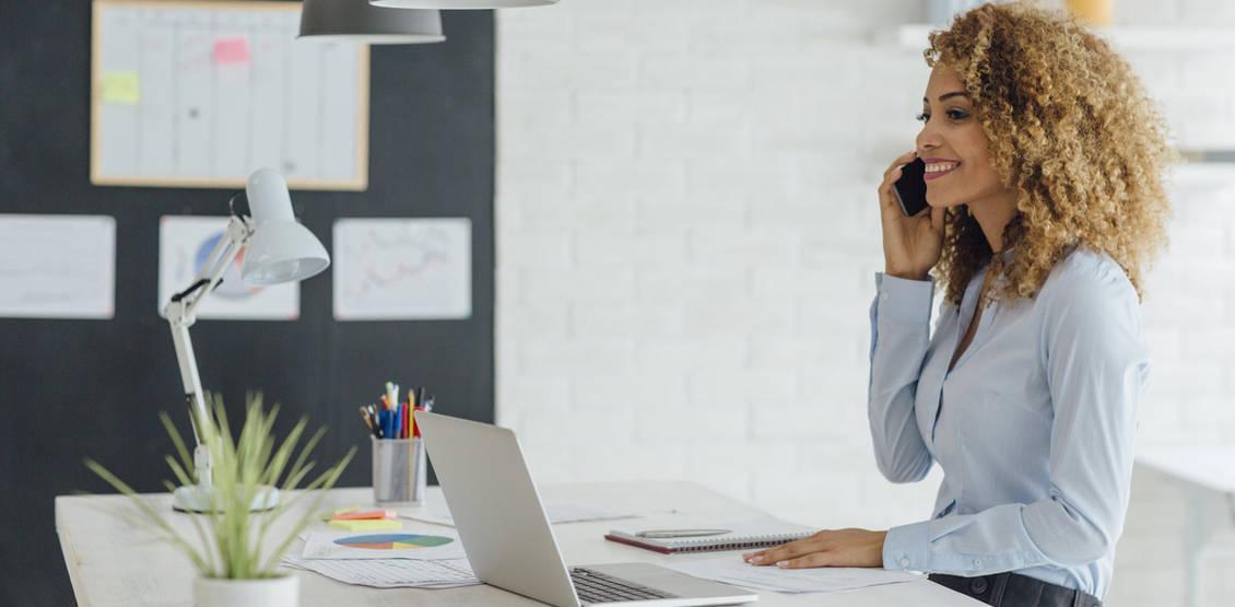 Latina Businesswoman Working In Her Office