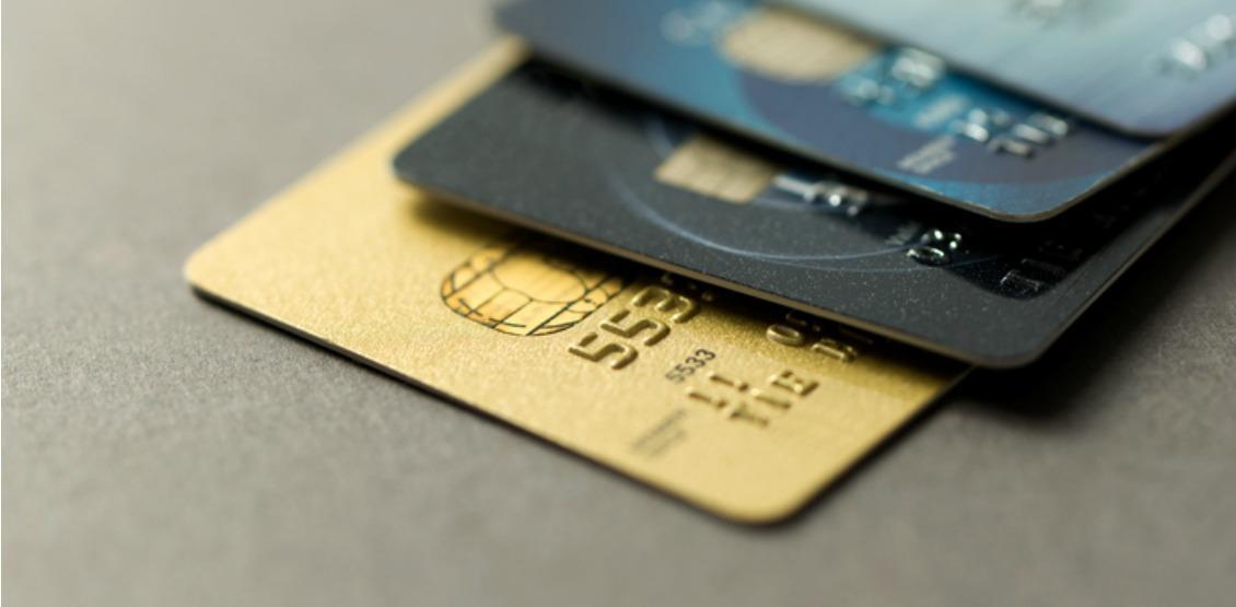 Close up of credit cards over grey background