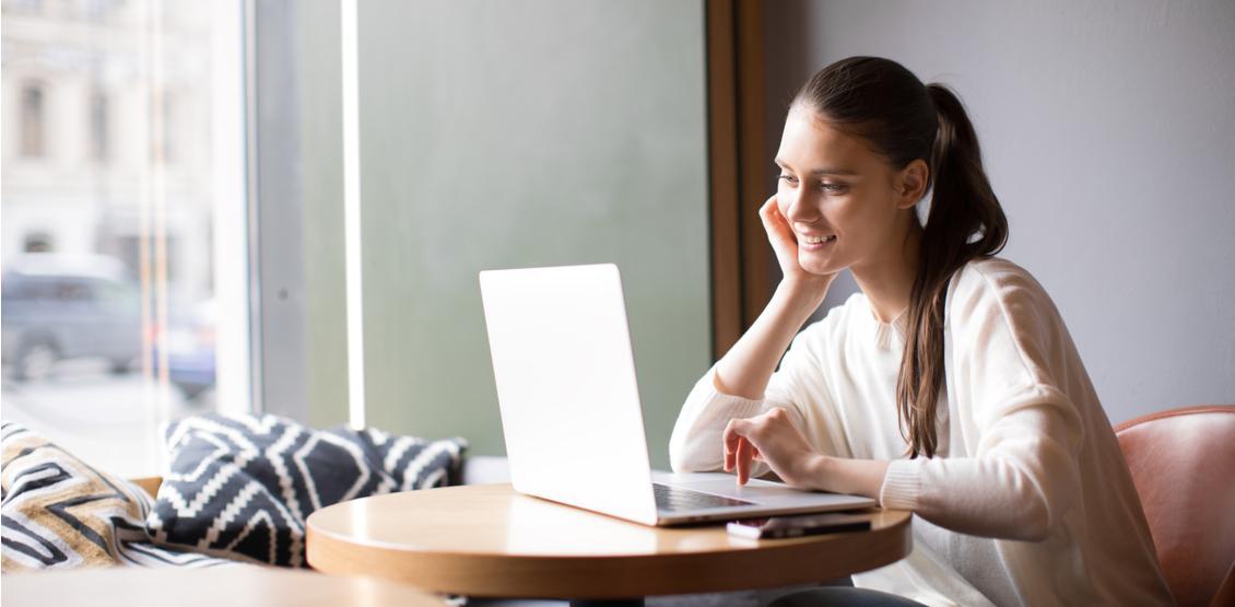 Woman Checking Email on Laptop