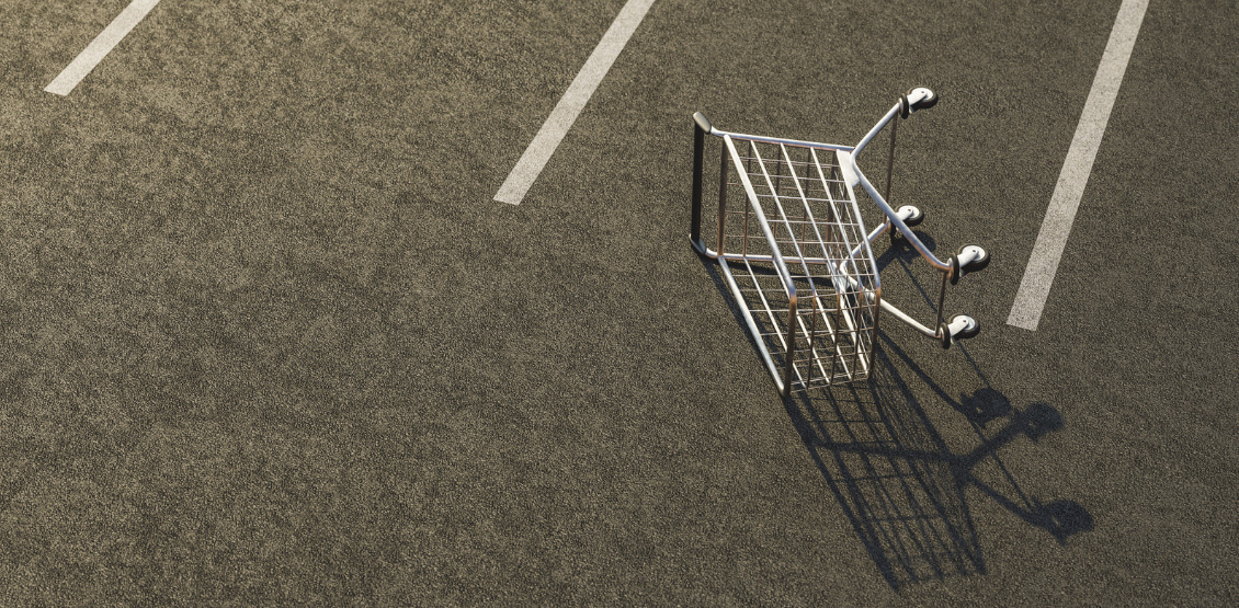 shopping-cart-overturned-on-a-parking-lot-picture-id1344807403