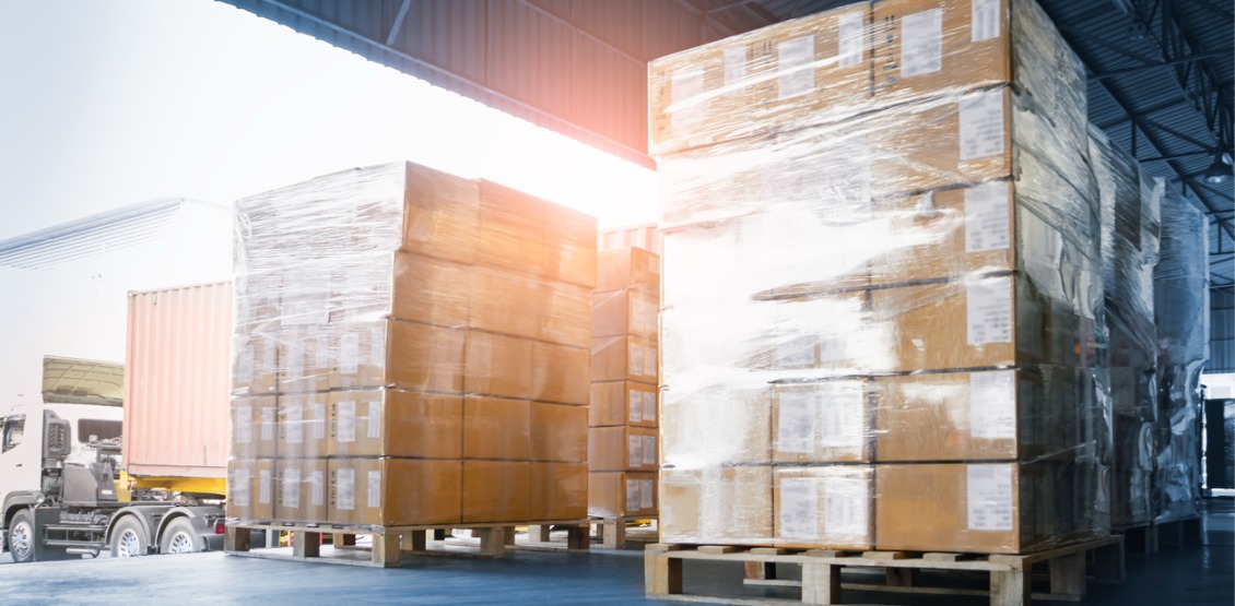 stacked-of-package-boxes-loading-into-container-truck-truck-parked-picture-id1316180303